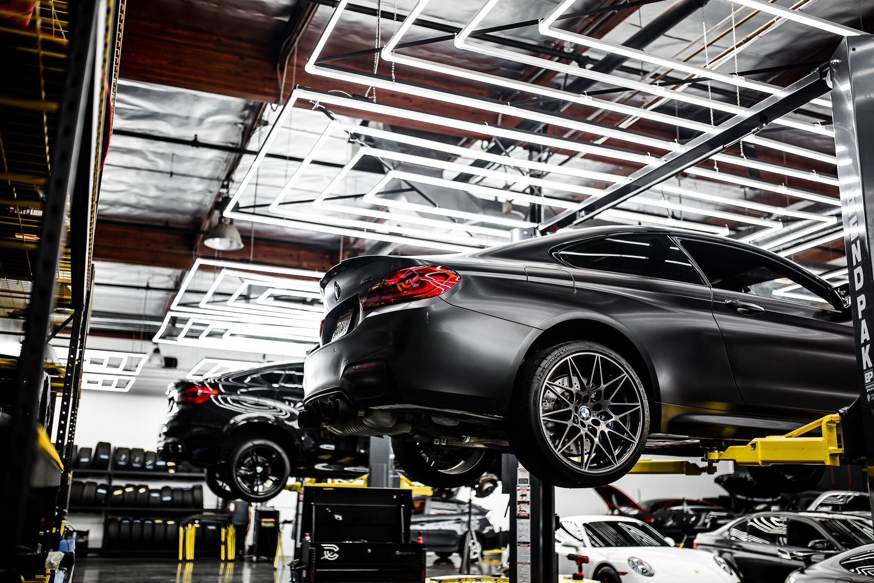Modern performance car receiving service in a professional repair shop
