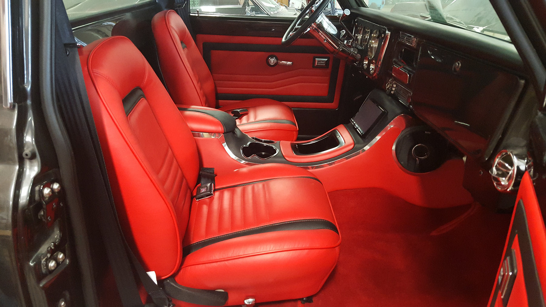 Finished red and black custom interior built by Top Secret Customs